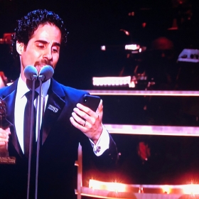 Alex Lacamoire, collecting Outstanding Achievement in Music for Hamilton, sings an acceptance from Lin-Manuel Miranda
