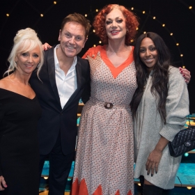 Debbie McGee, Brian Conley, Craig Revel Horwood (Miss Hannigan) and Alexandra Burke - Annie at the Piccadilly Theatre - Photo credit Craig Sugden